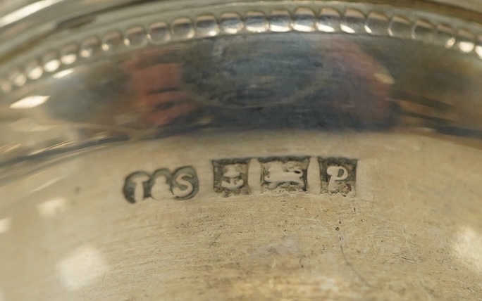 Small silver including a pair of napkin rings and two others, a Georgian sauce ladle and two similar dessert spoons, a fish slice, fork and an unmarked toddy ladle with inset coin bowl. Condition - poor to fair